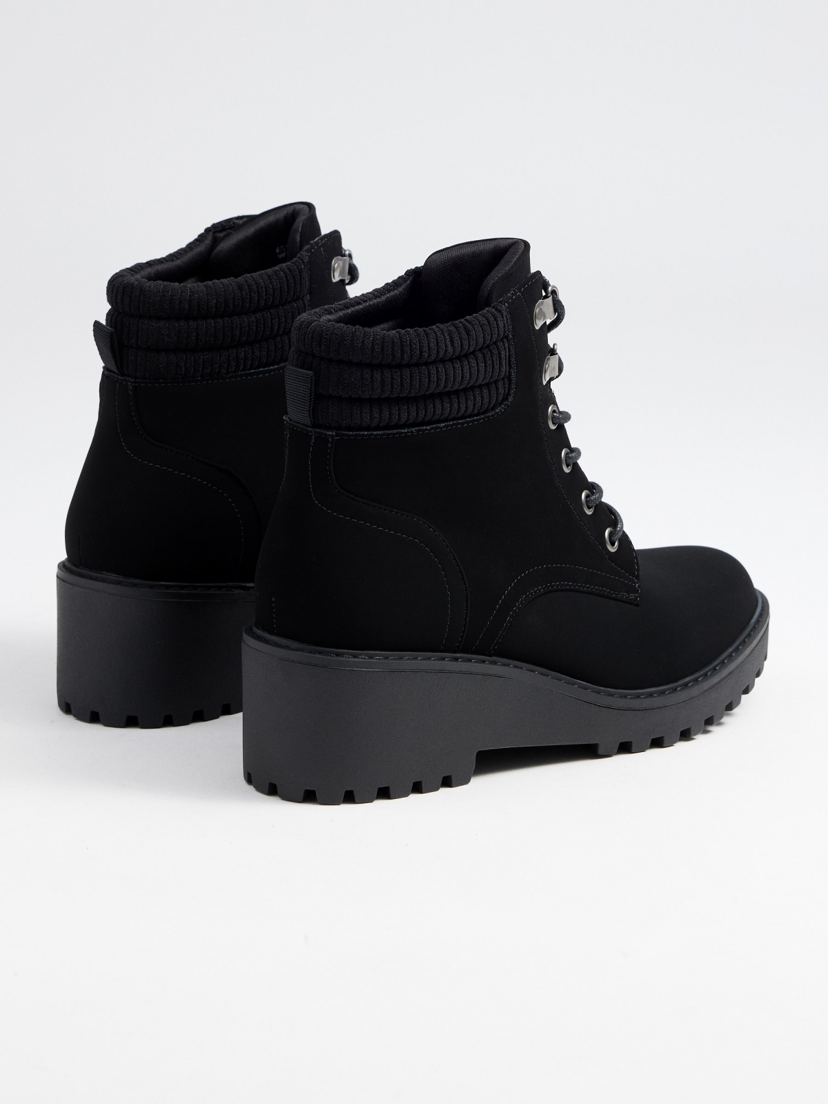 Mountain style wedge ankle boots black 45º back view