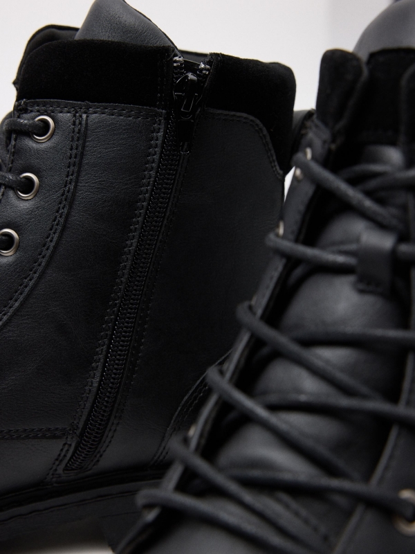 Patent leather boot with buckle black detail view