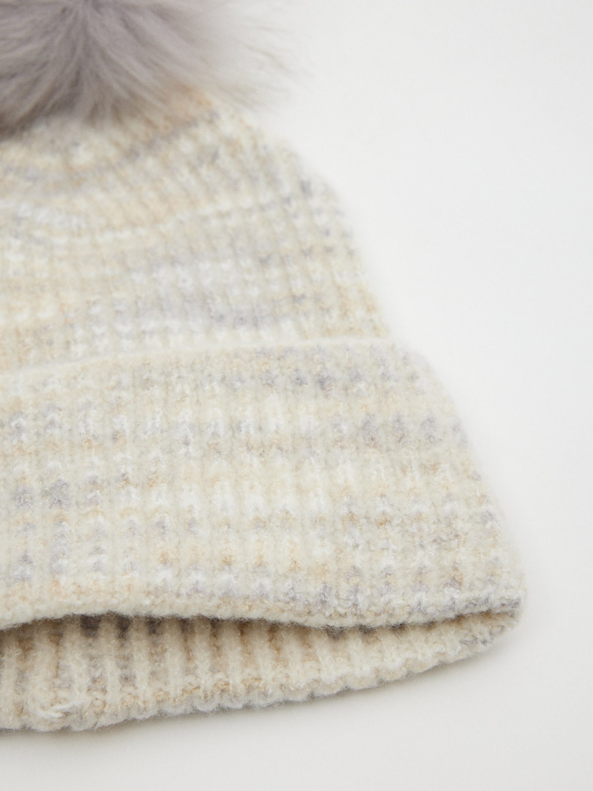 Knitted hat with pompom grey detail view