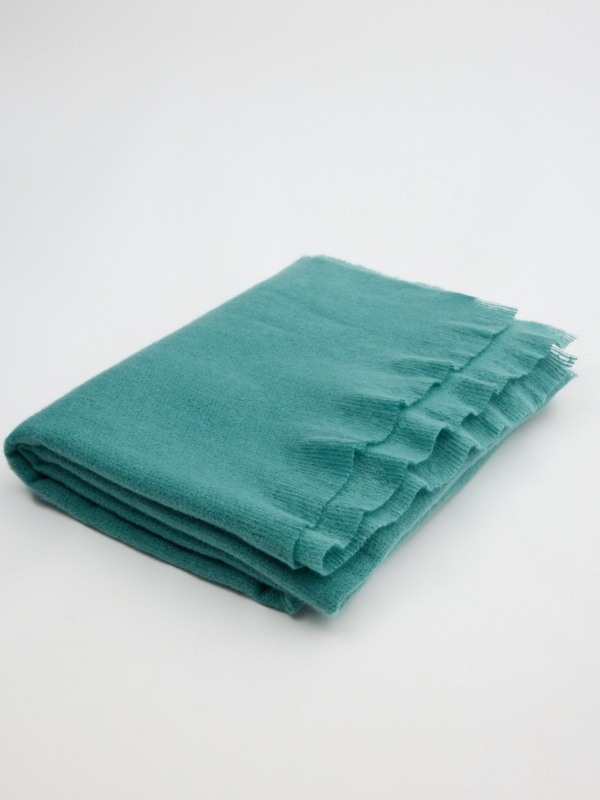 Bufanda de punto de color azul claro vista enrollado