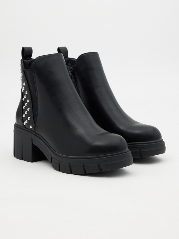 Ankle boots with elastic and studs black 45º front view