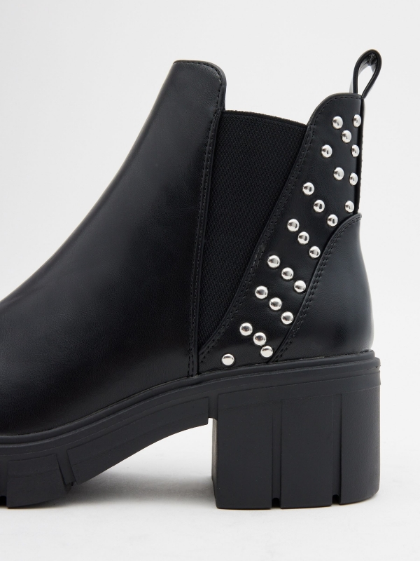 Ankle boots with elastic and studs black detail view