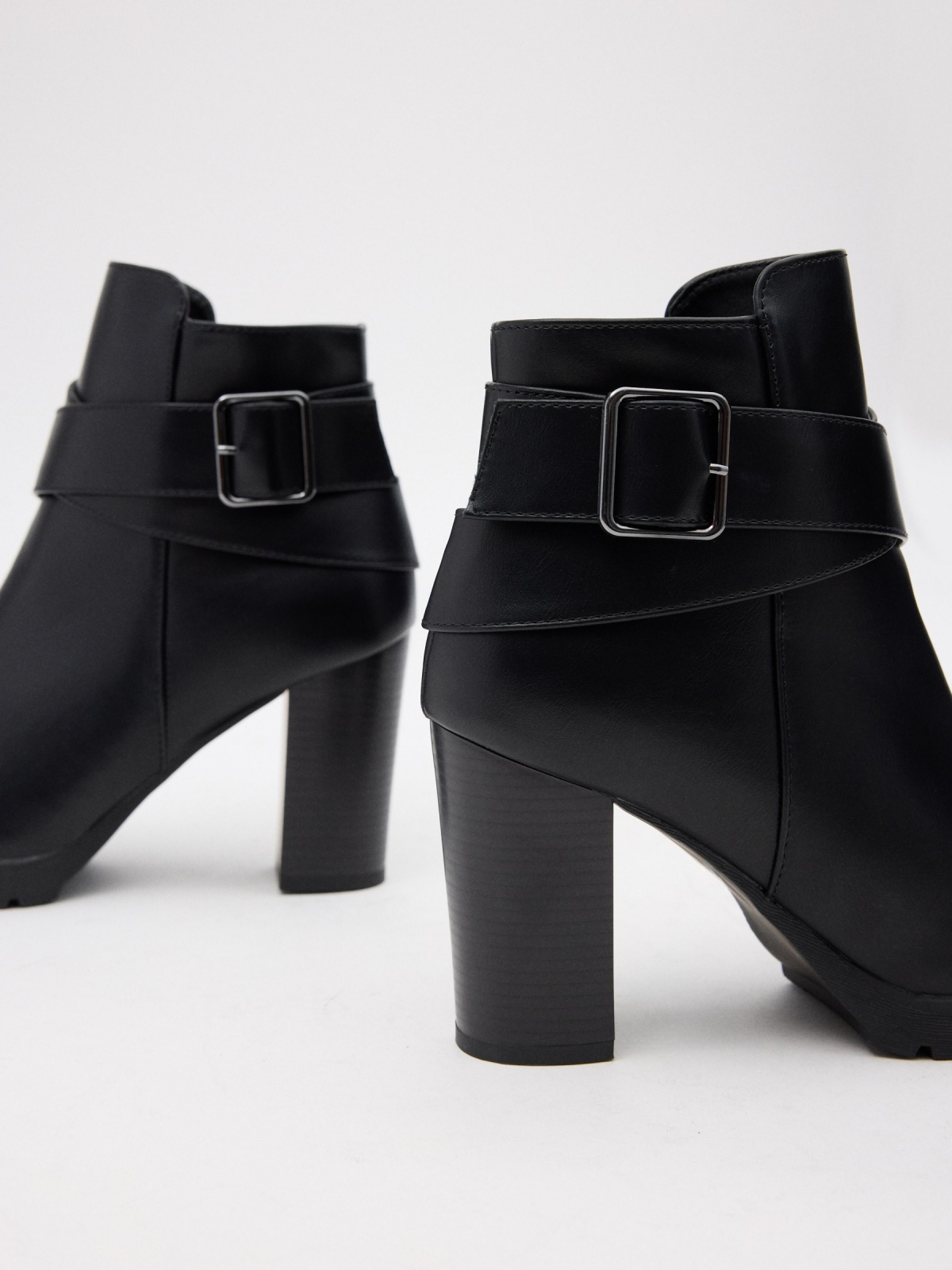 Ankle boots buckle cross straps black detail view