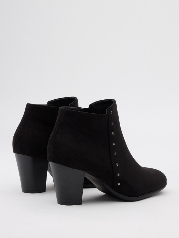 Heeled ankle boots with studs black 45º back view