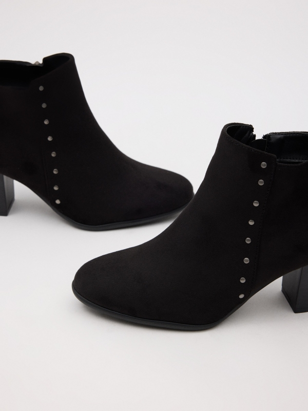 Heeled ankle boots with studs black detail view