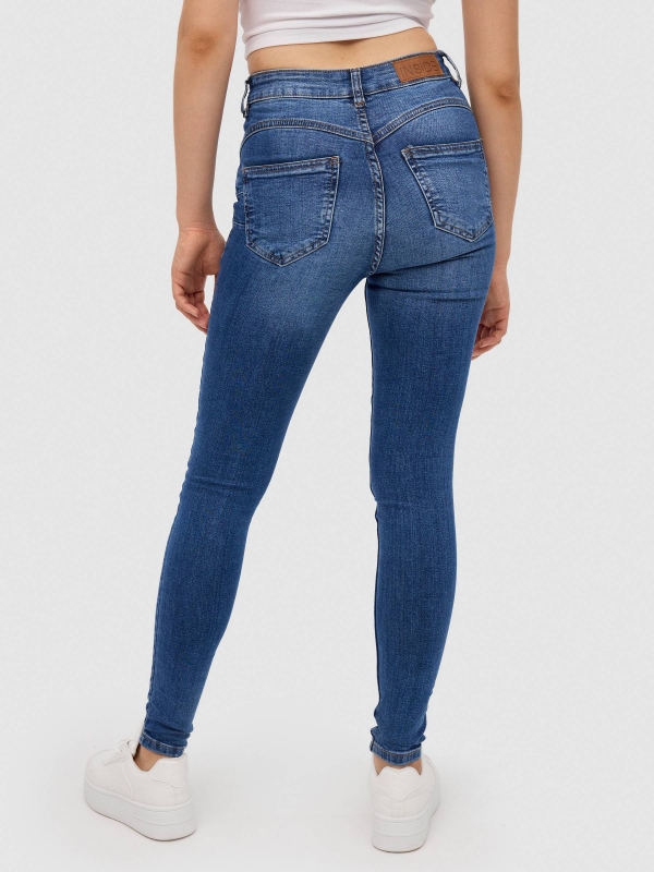 Jeans skinny push up tiro alto azul vista media trasera