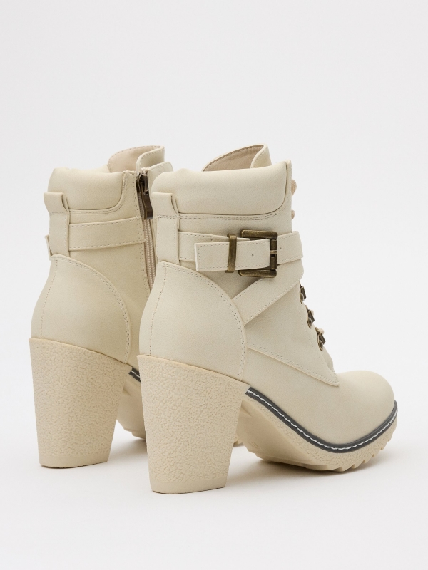 Ankle boots with crossed buckle white 45º front view