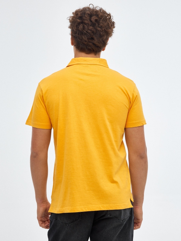 Basic polo shirt classic collar ochre middle back view