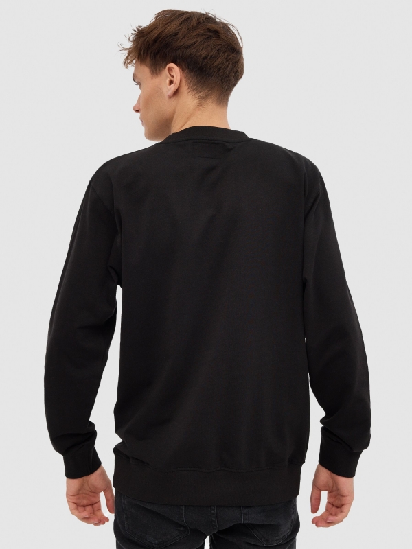 INSIDE hoodless sweatshirt black middle back view