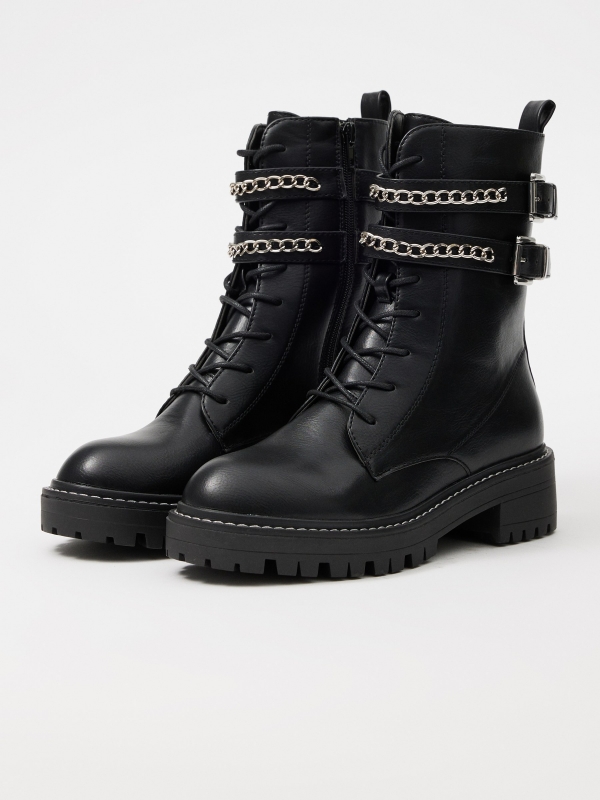 Ankle boot with buckles and chain black 45º front view