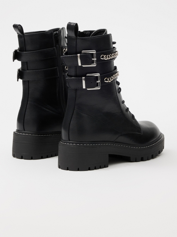 Ankle boot with buckles and chain black 45º back view