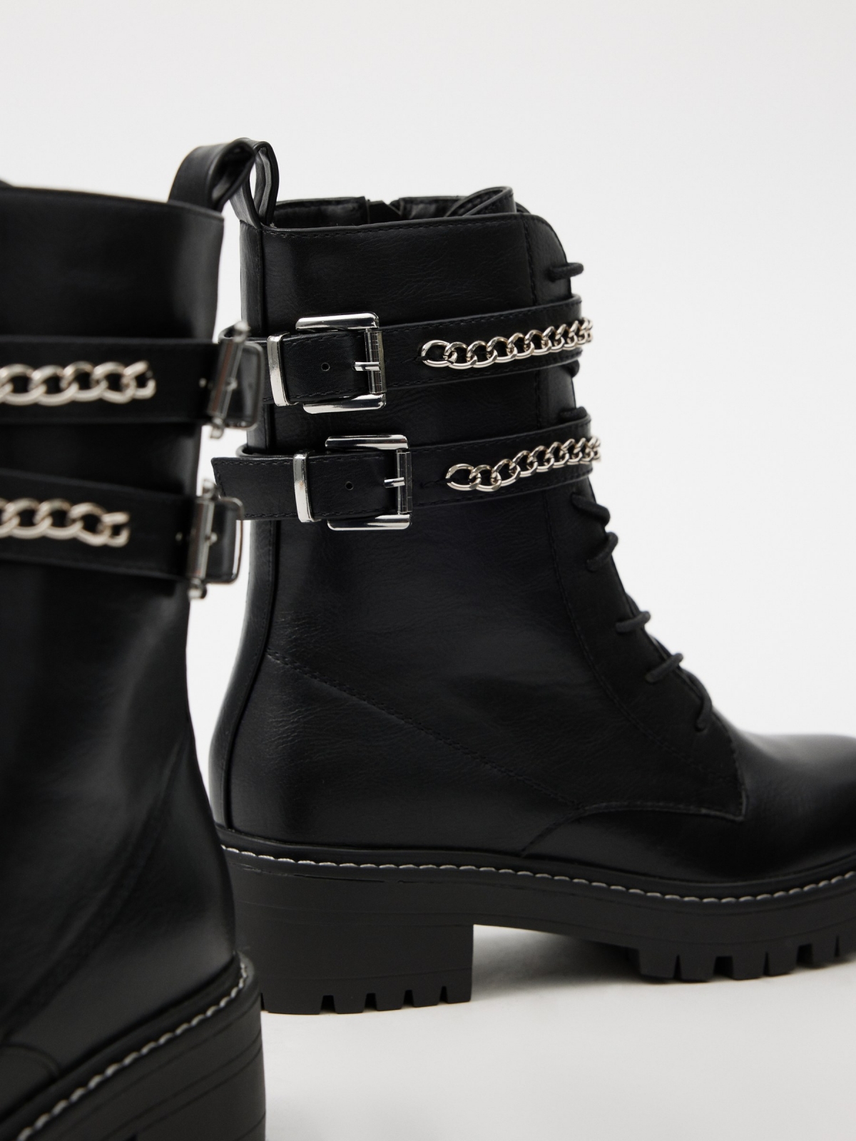 Ankle boot with buckles and chain black detail view