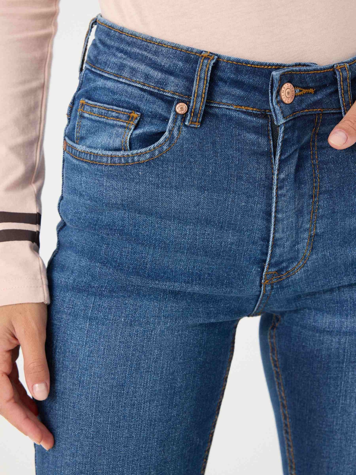 Blue medium waist skinny jeans indigo detail view