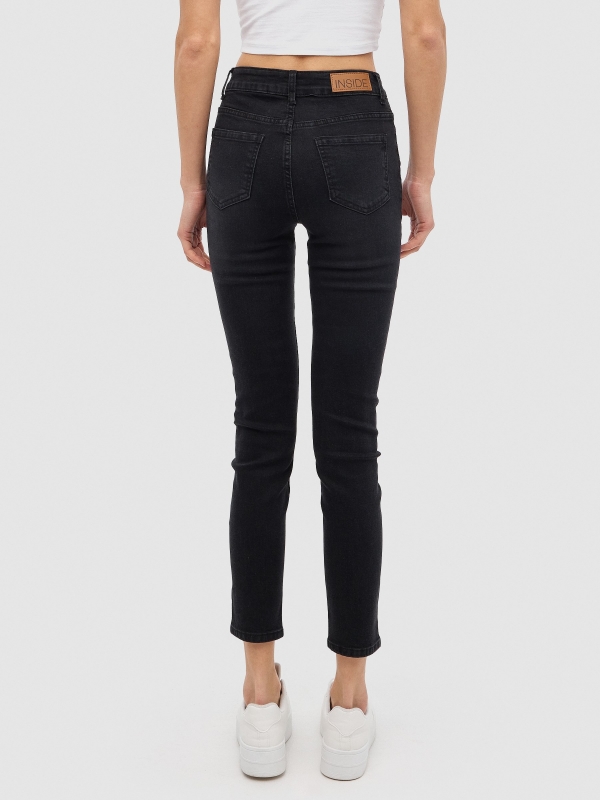 Grey skinny jeans with frayed effect dark grey middle back view