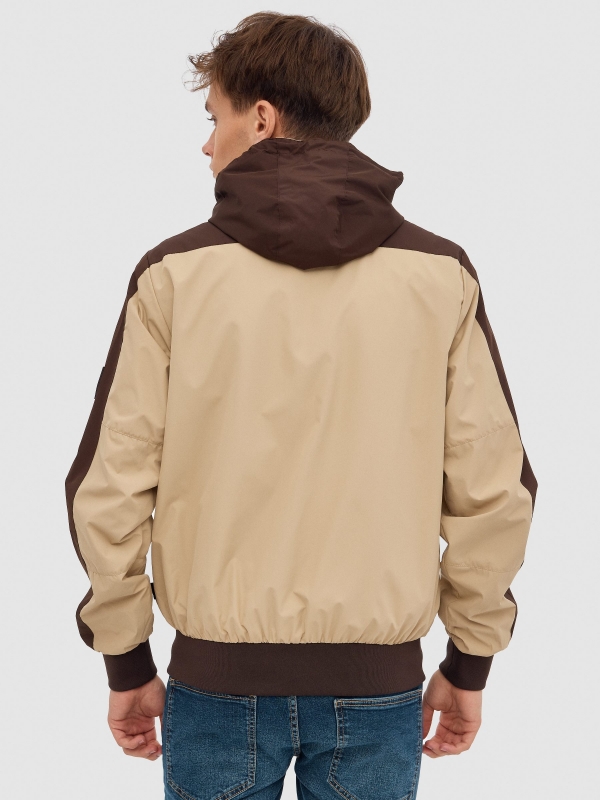 Nylon jacket with hood sand middle back view