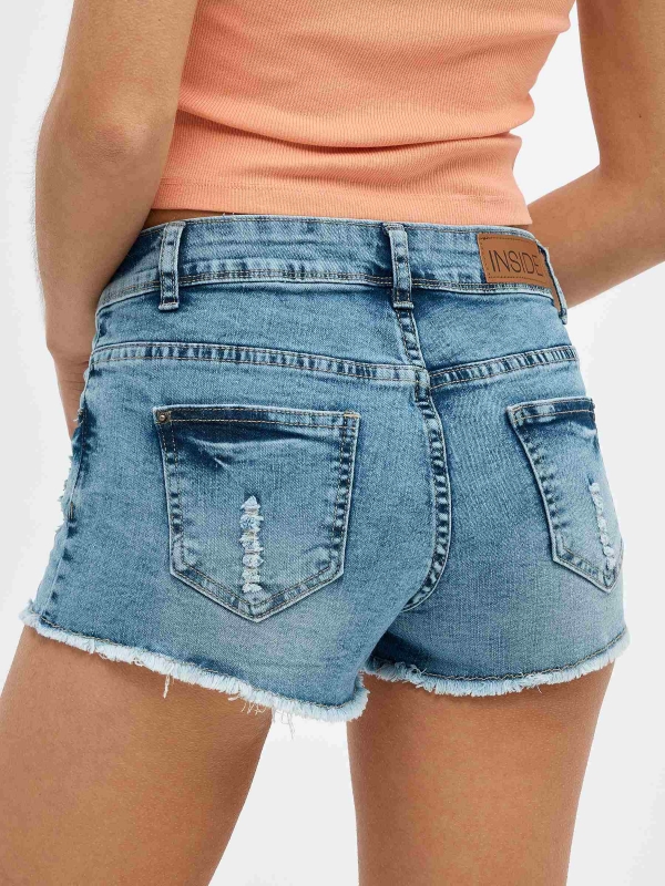Ripped distressed denim shorts blue detail view
