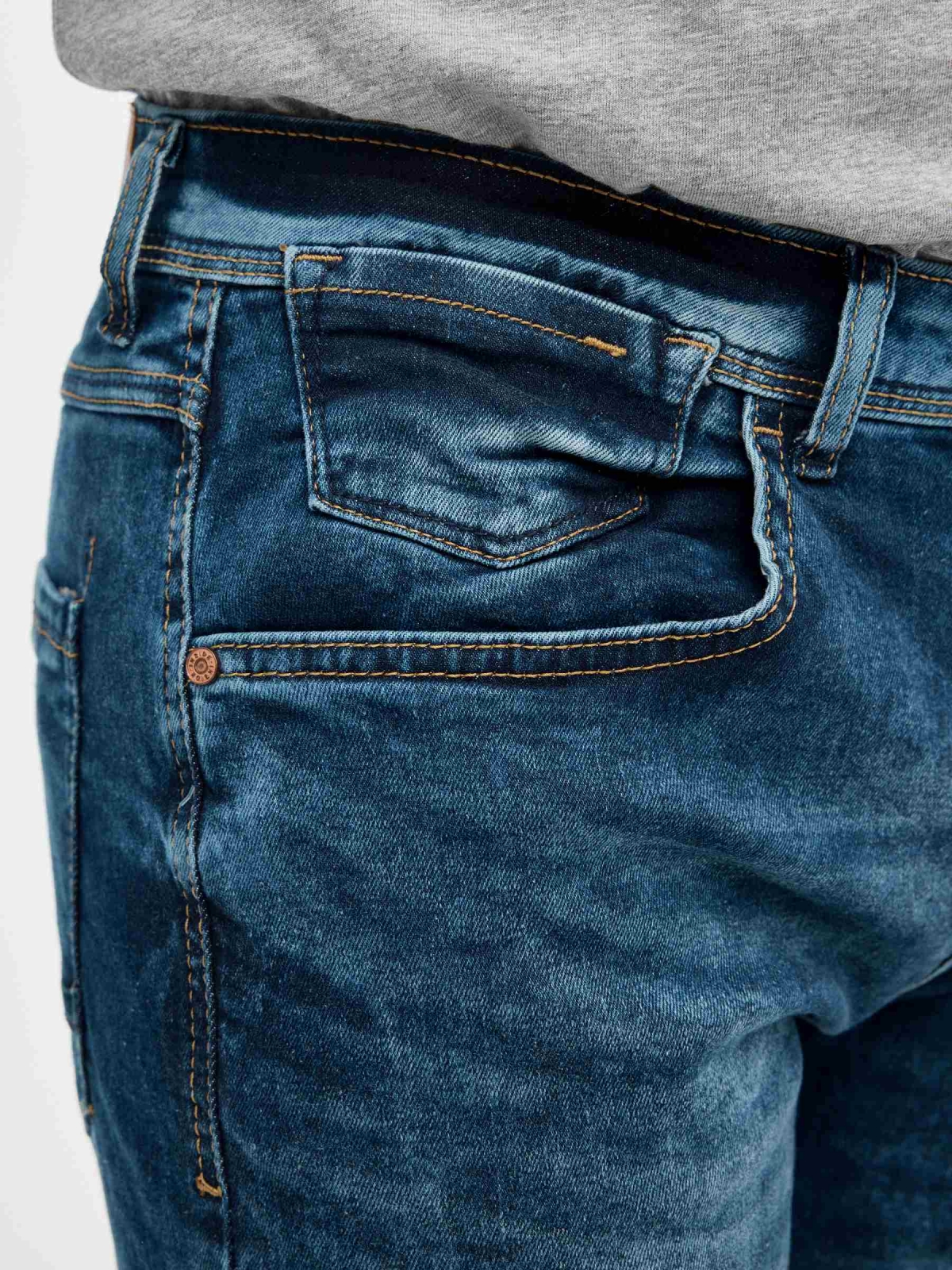Distressed blue denim bermuda shorts blue detail view