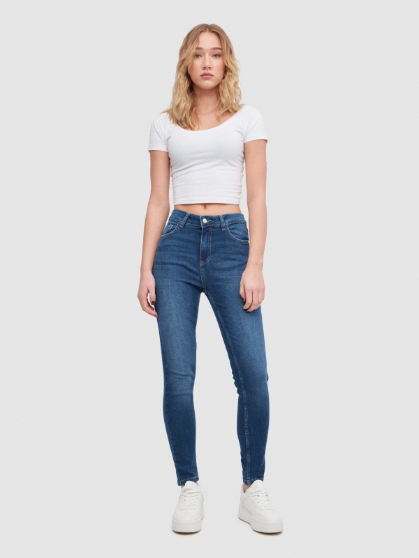 Ripped mid-rise skinny jeans dark blue front view