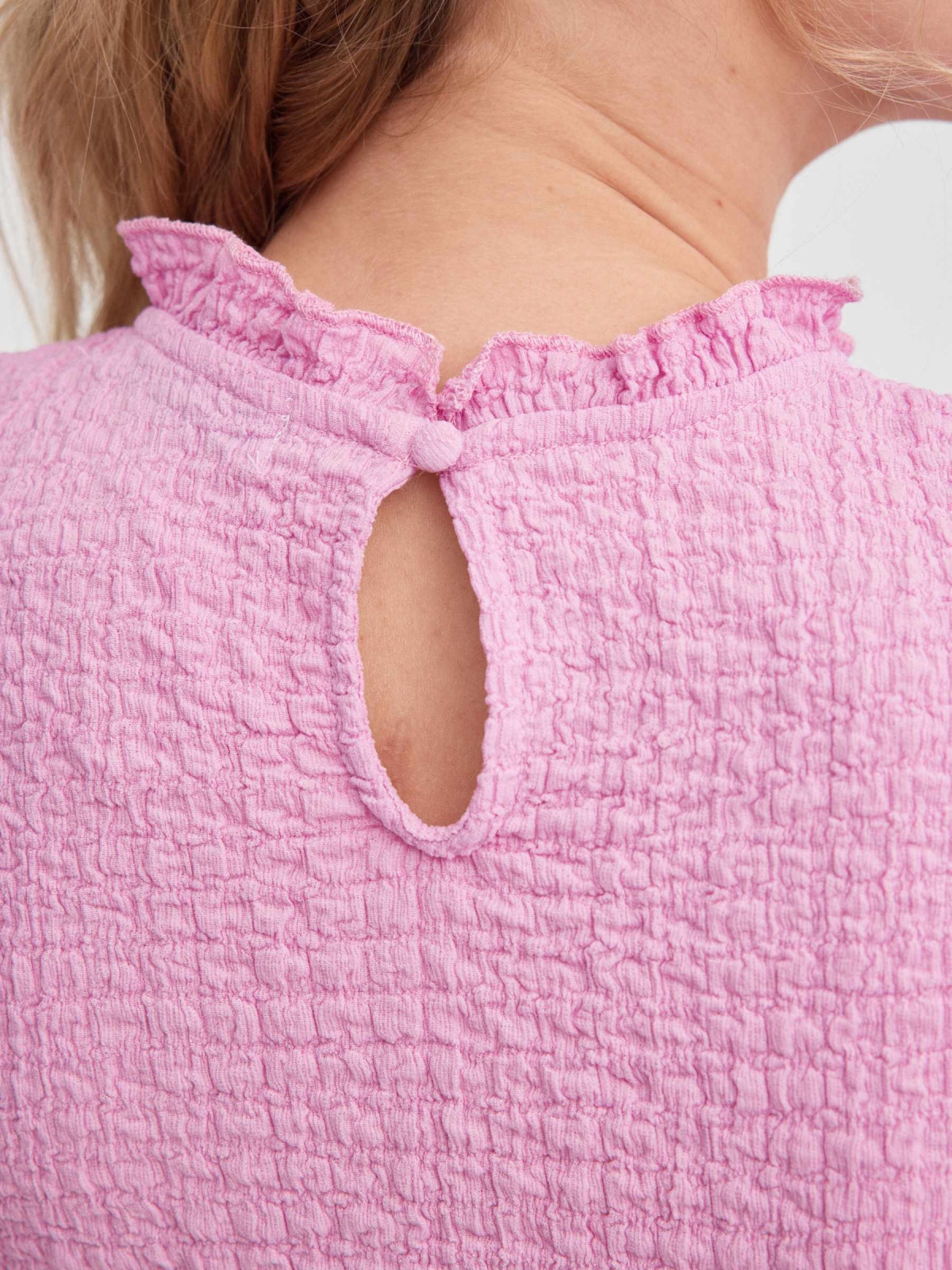 Ruffled top with cut out back magenta detail view
