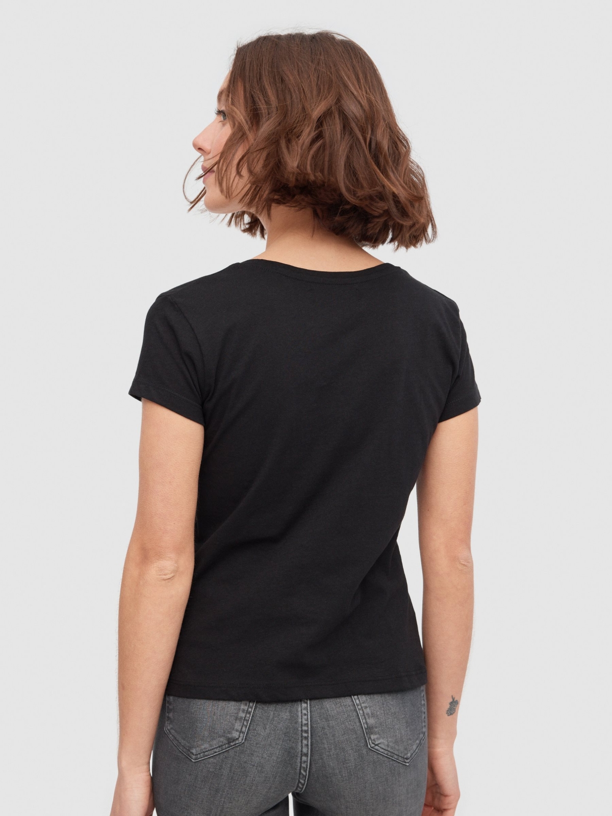 Camiseta crop Mariposa negro vista media trasera