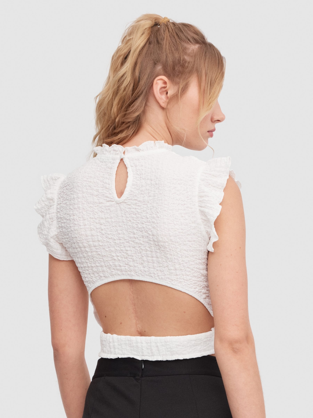 Ruffled top with cut out back white middle back view