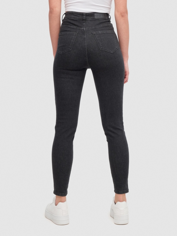Black skinny jeans high rise black middle back view