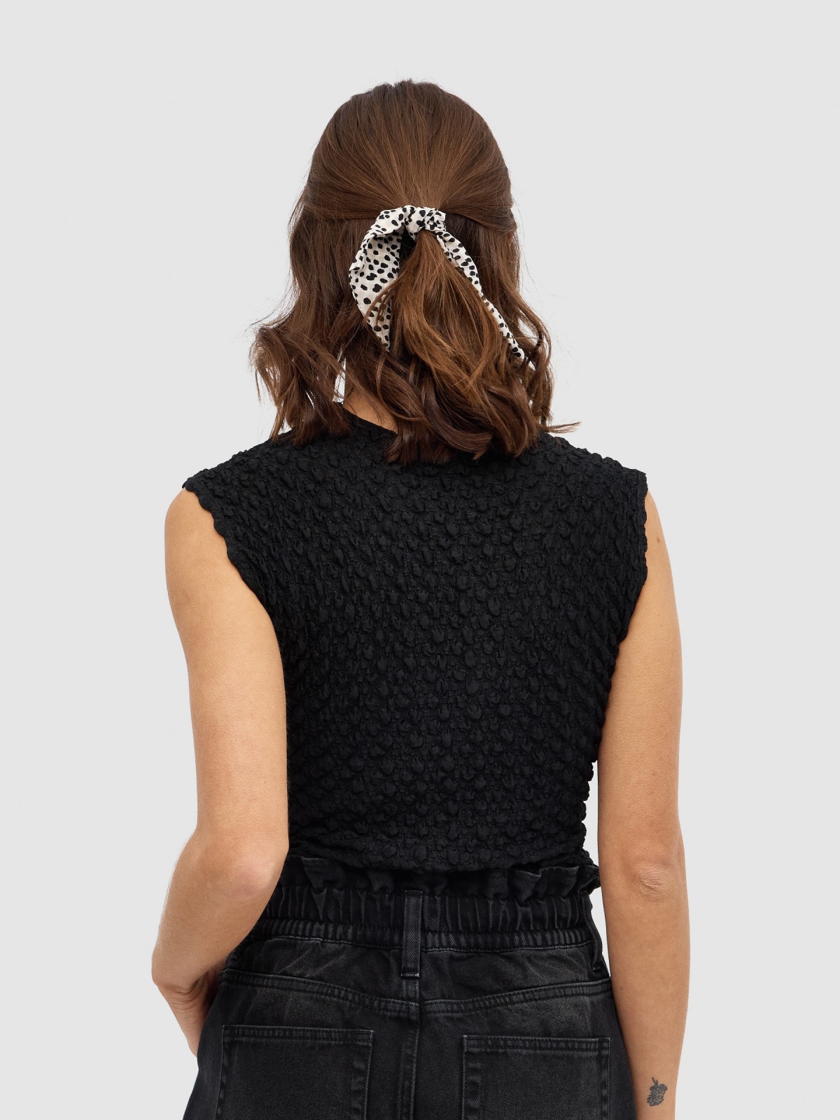 Top cut out ruffled black middle back view
