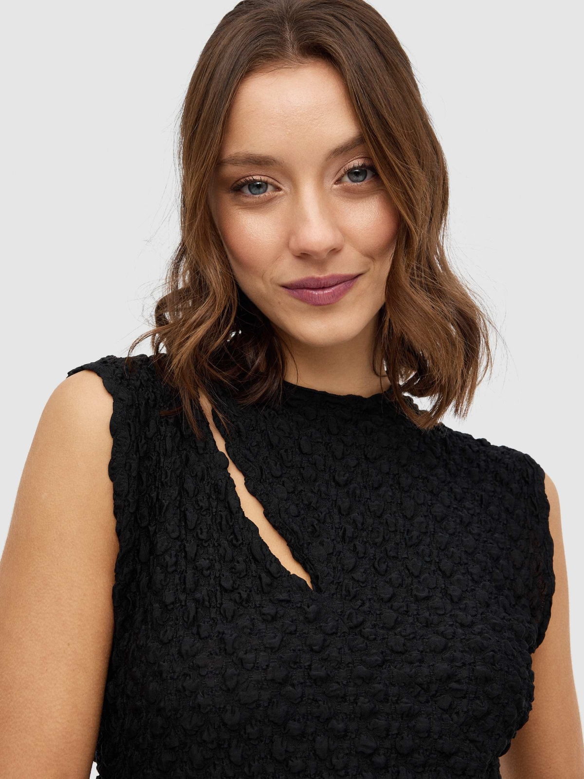 Top cut out ruffled black detail view