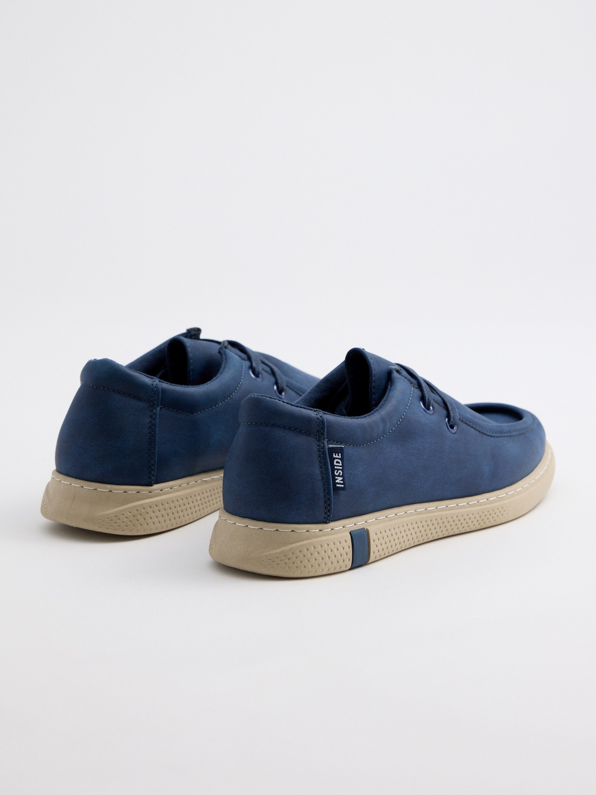 Navy blue wallabee shoe navy 45º back view