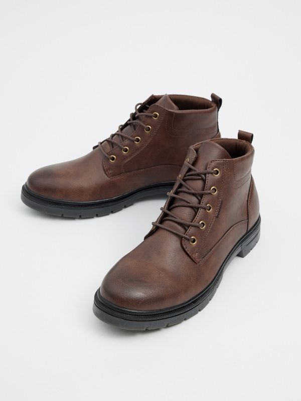 Brown faux leather boot with laces chocolate detail view