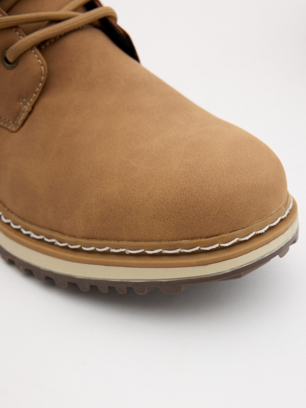 Brown boot with seam cinnamon detail view