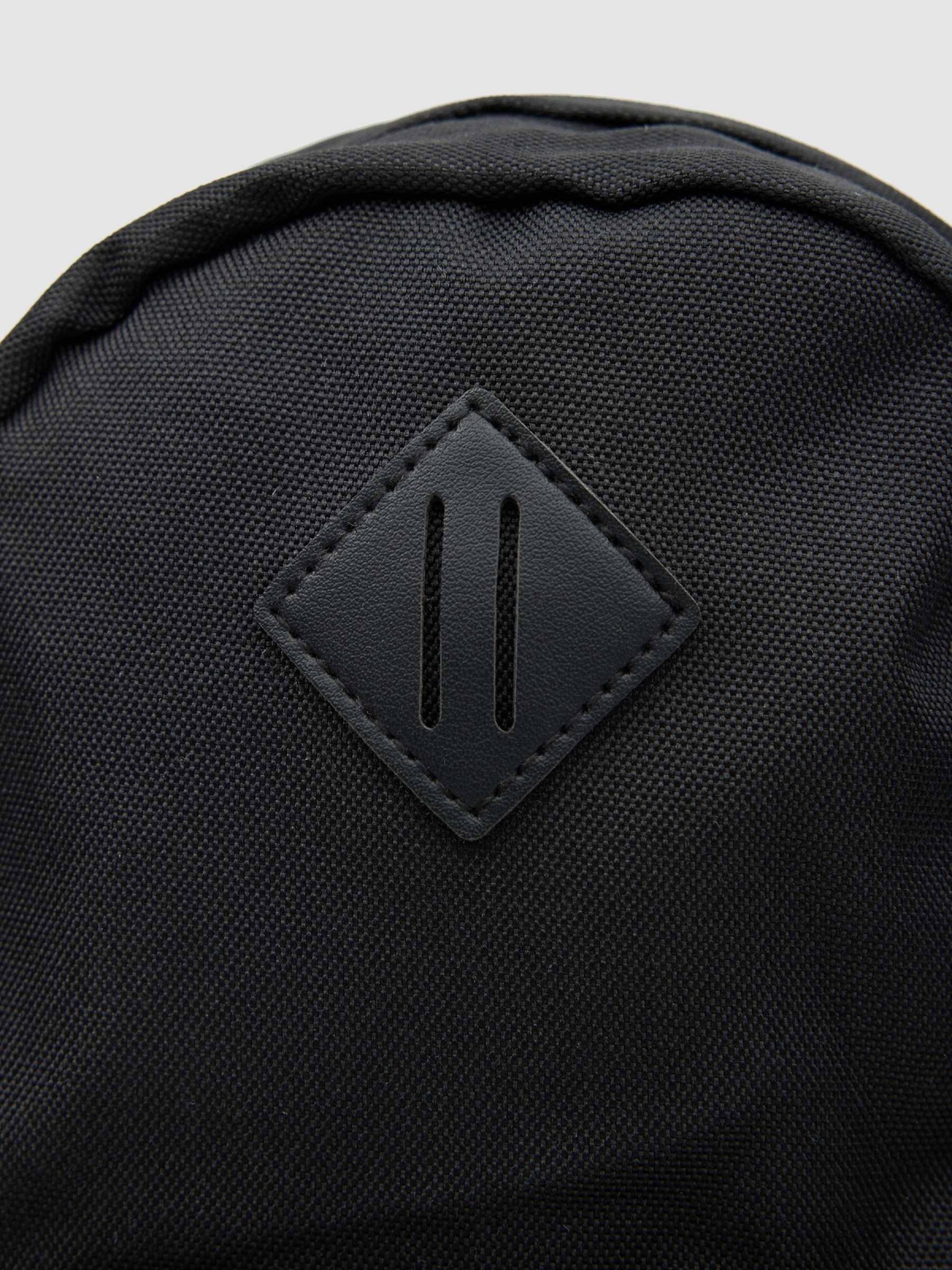 Crossed backpack detail view