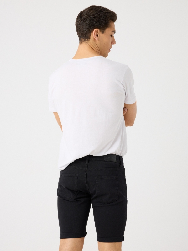 Coloured denim shorts black middle back view
