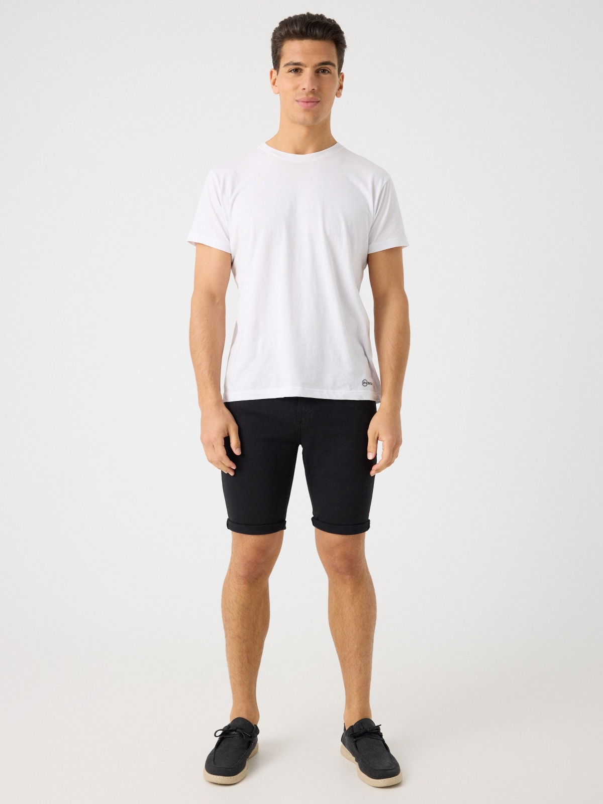 Coloured denim shorts black front view
