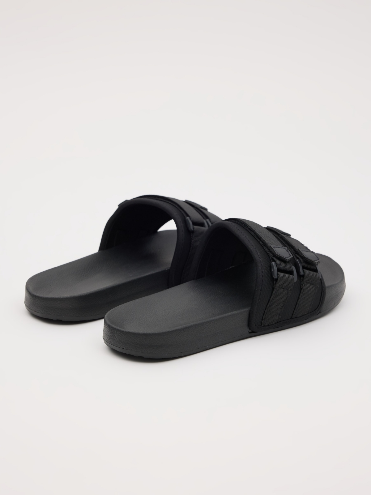 Flip flops with buckle fasteners black 45º back view
