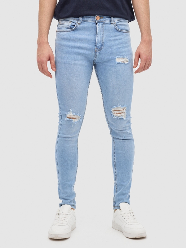 Jeans skinny azul vista meia frontal
