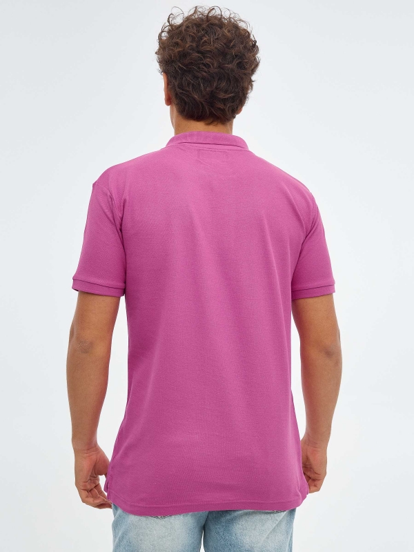 Basic polo shirt with engraved logo fuchsia middle back view