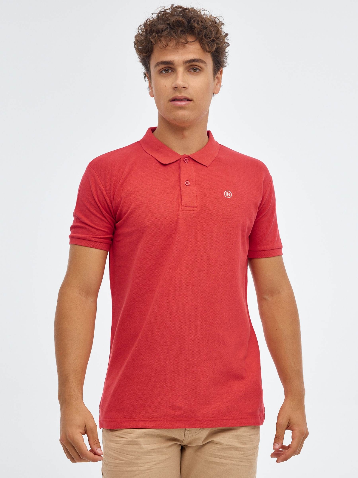 Basic polo shirt with engraved logo red middle front view