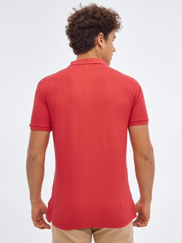 Basic polo shirt with engraved logo red middle back view