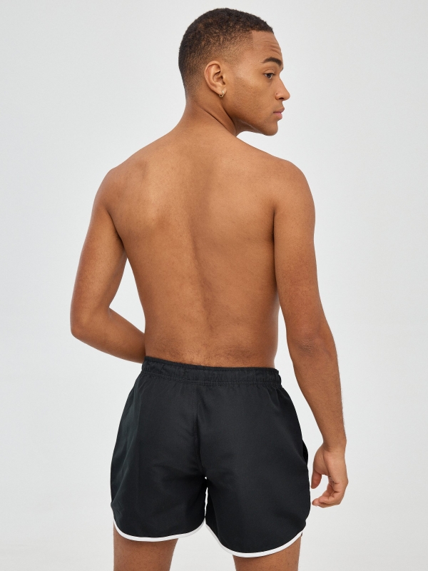Contrast trim short swimsuit black middle back view