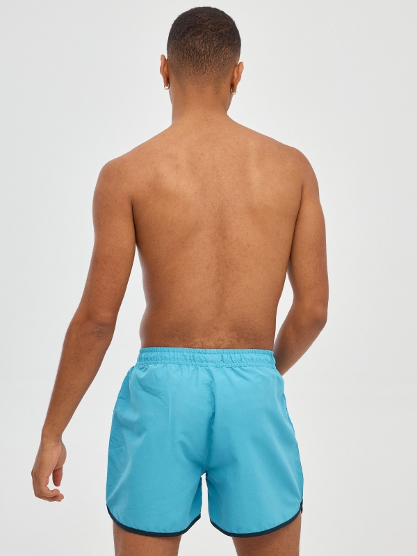 Contrast trim short swimsuit blue middle back view