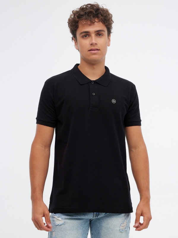 Basic polo shirt with engraved logo black/beige middle front view
