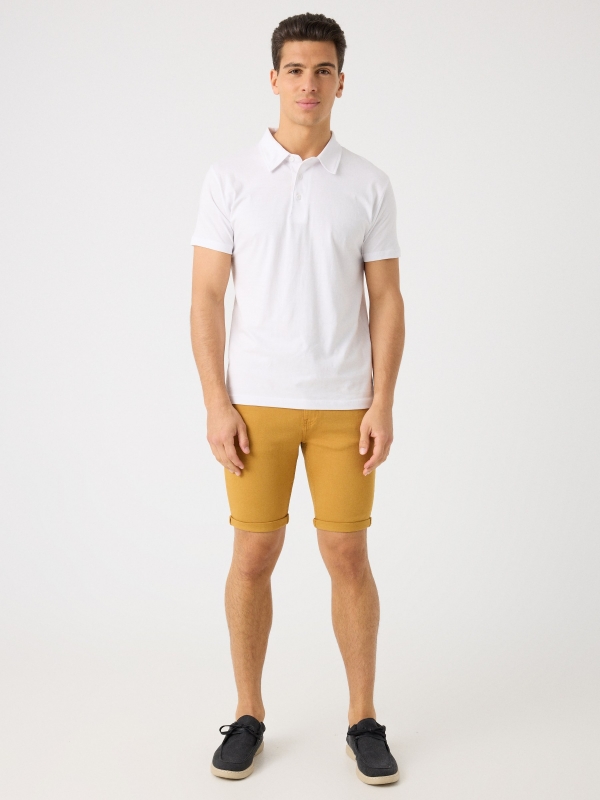 Coloured denim shorts ochre front view