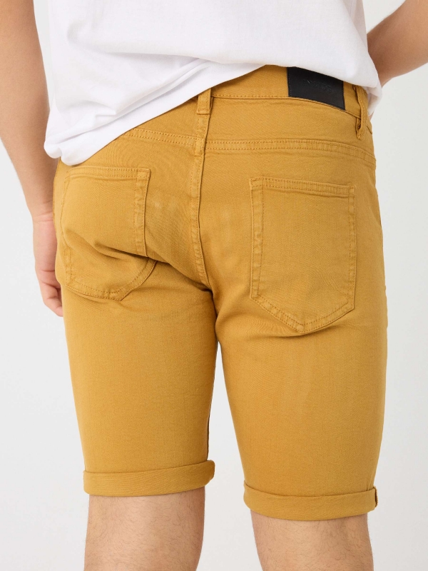 Coloured denim shorts ochre detail view