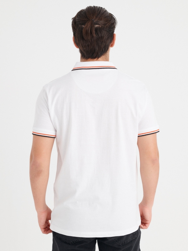 Basic polo with piping white middle back view