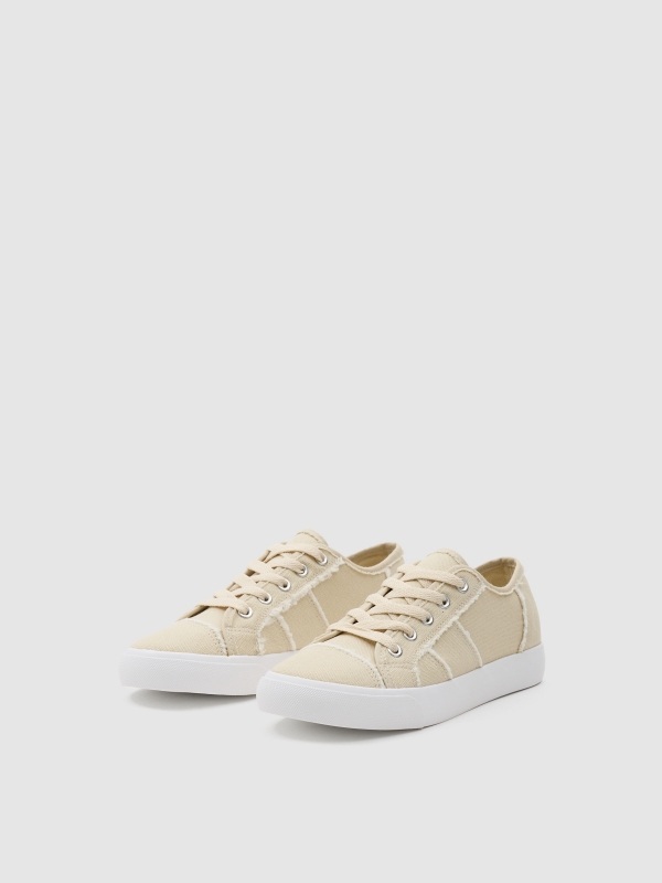 Canvas sneaker untucked sand 45º front view