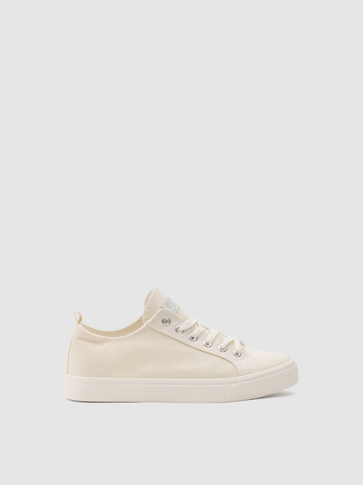 Shiny canvas sneaker off white with a model
