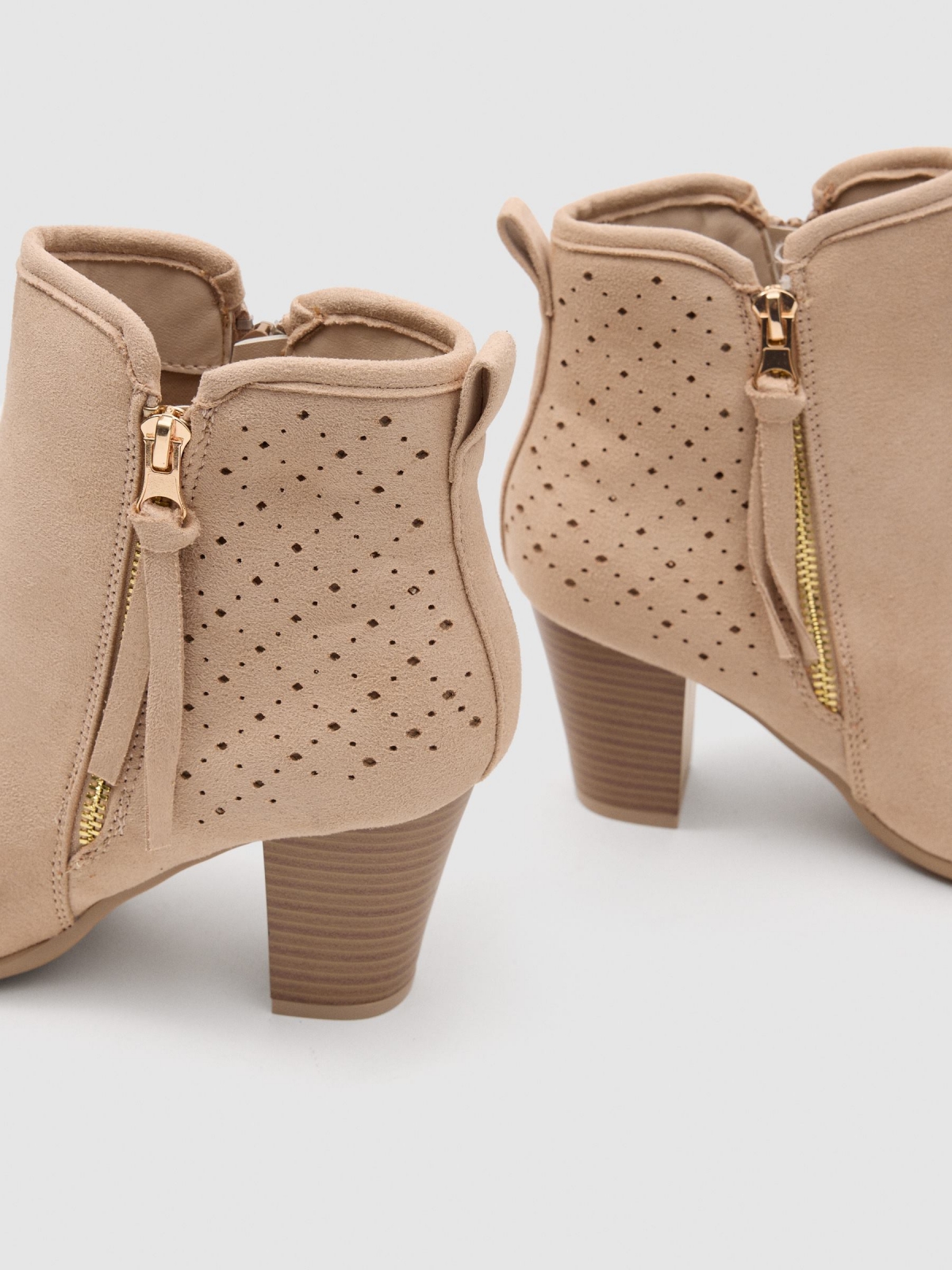 Low-heel die-cut leather-effect ankle boot sand detail view