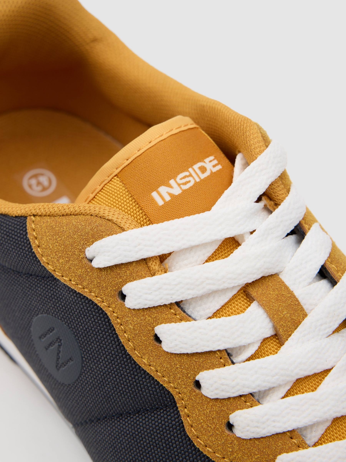 Two-tone contrast sneaker mustard detail view