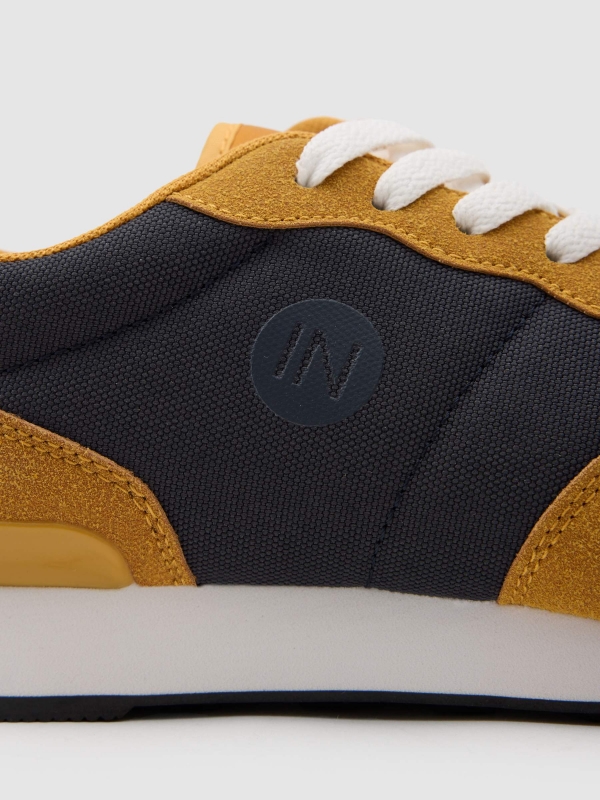 Two-tone contrast sneaker mustard detail view